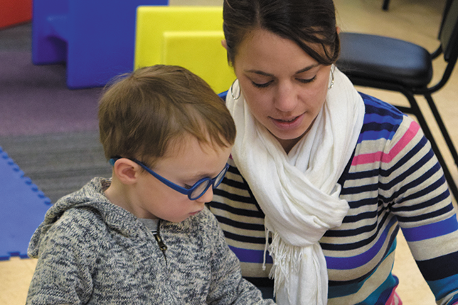 Miss Emily works with Lucas in the Sensory Tots program at Vision Forward.