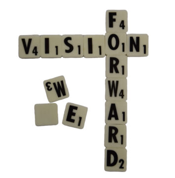 Scrabble tiles spelling Vision Forward.