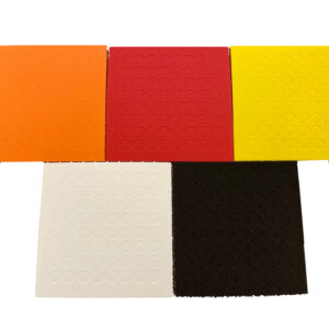 From top left to bottom right, a sheet of orange, red, yellow, white and black bump dots.