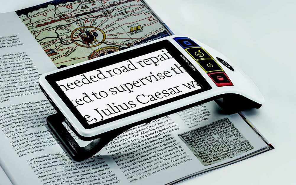 Eschenbach Smartlux Digital portable video magnifier with a 5-inch display and color-coded tactile control buttons.
