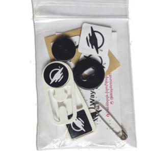 Clear baggie with a number of WayTags, buttons, magnets and a safety pin.