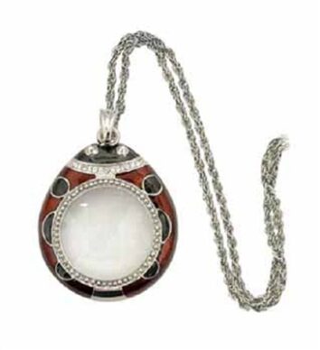 3x Red Ladybug Pendant magnifier from the top. The pendant is red with black dots and a silver chain.