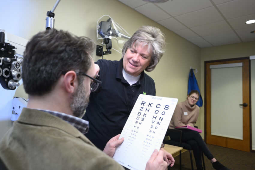 Client working with low vision optometrist.