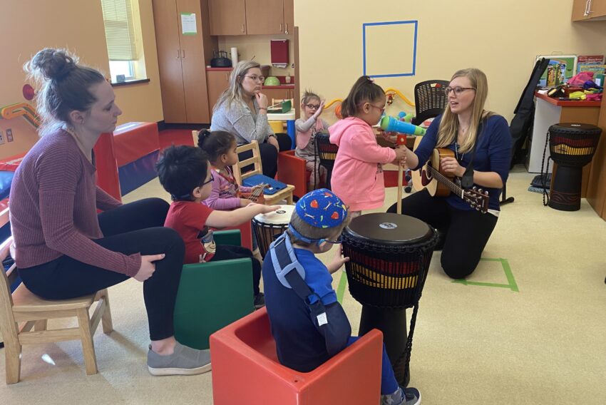 Photo of children participating in music therapy.