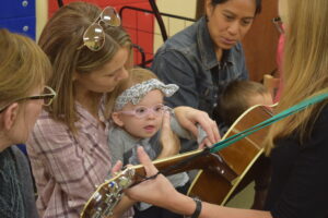 McKinley enjoying music therapy at Vision Forward.