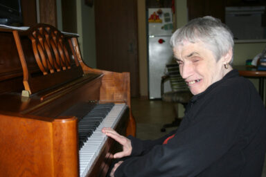 Pat playing the piano.