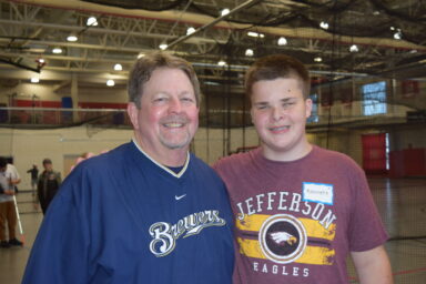 Youth and family member at Beep Baseball.