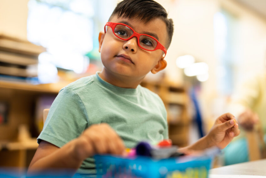 Photo of Isaac in the classroom.