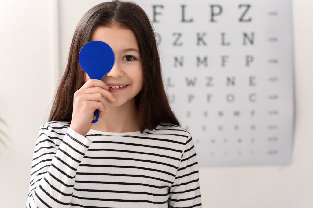 Little girl undergoing eye test in clinic