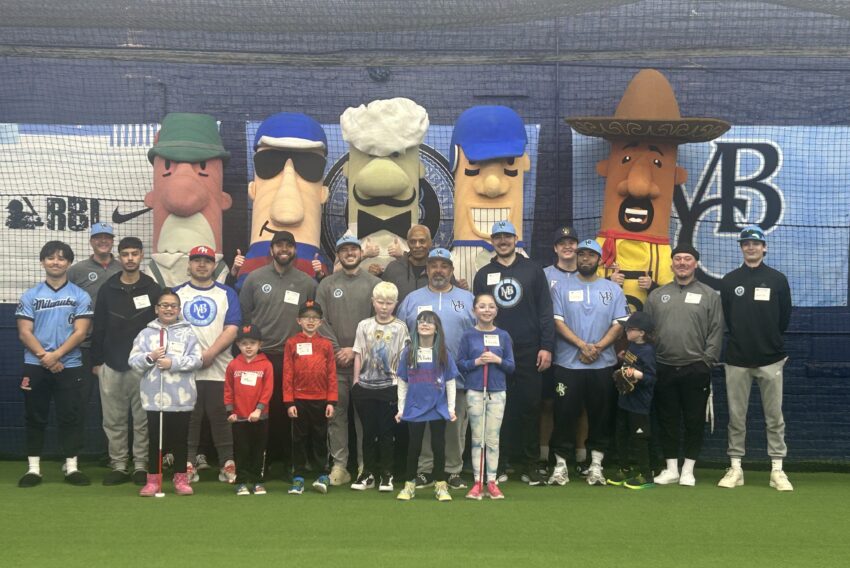 beep baseball event showing players, staff, racing sausages and kids at the milwaukee baseball club facility