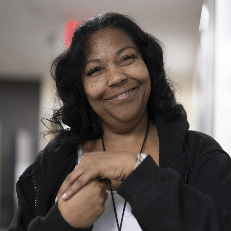 Black middle aged woman with visual impairment smiling 